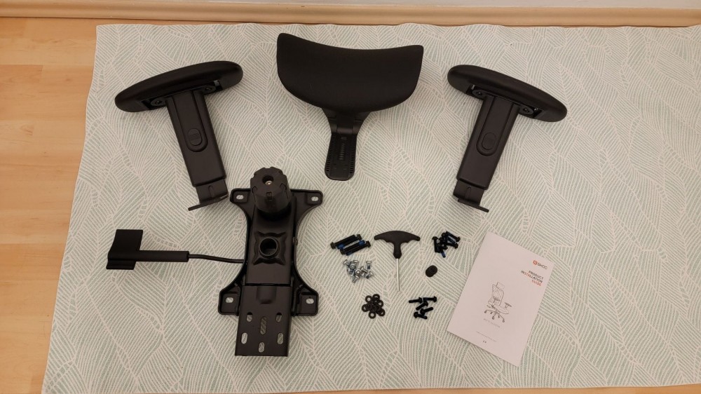 SIHOO M18 office chair headrest, armrests, and hardware before assembly